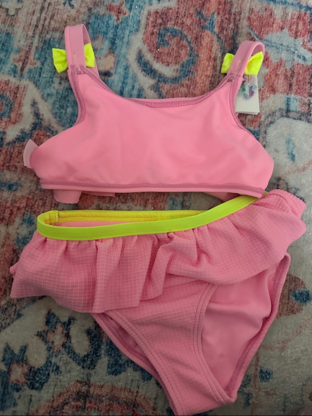 Girls Pink Two-Piece Ruffled Swimsuit with Neon Yellow Accents
